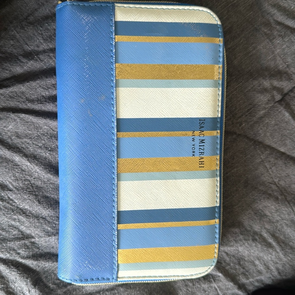 It’s a makeup brush with the wallet. Has never been used or touched